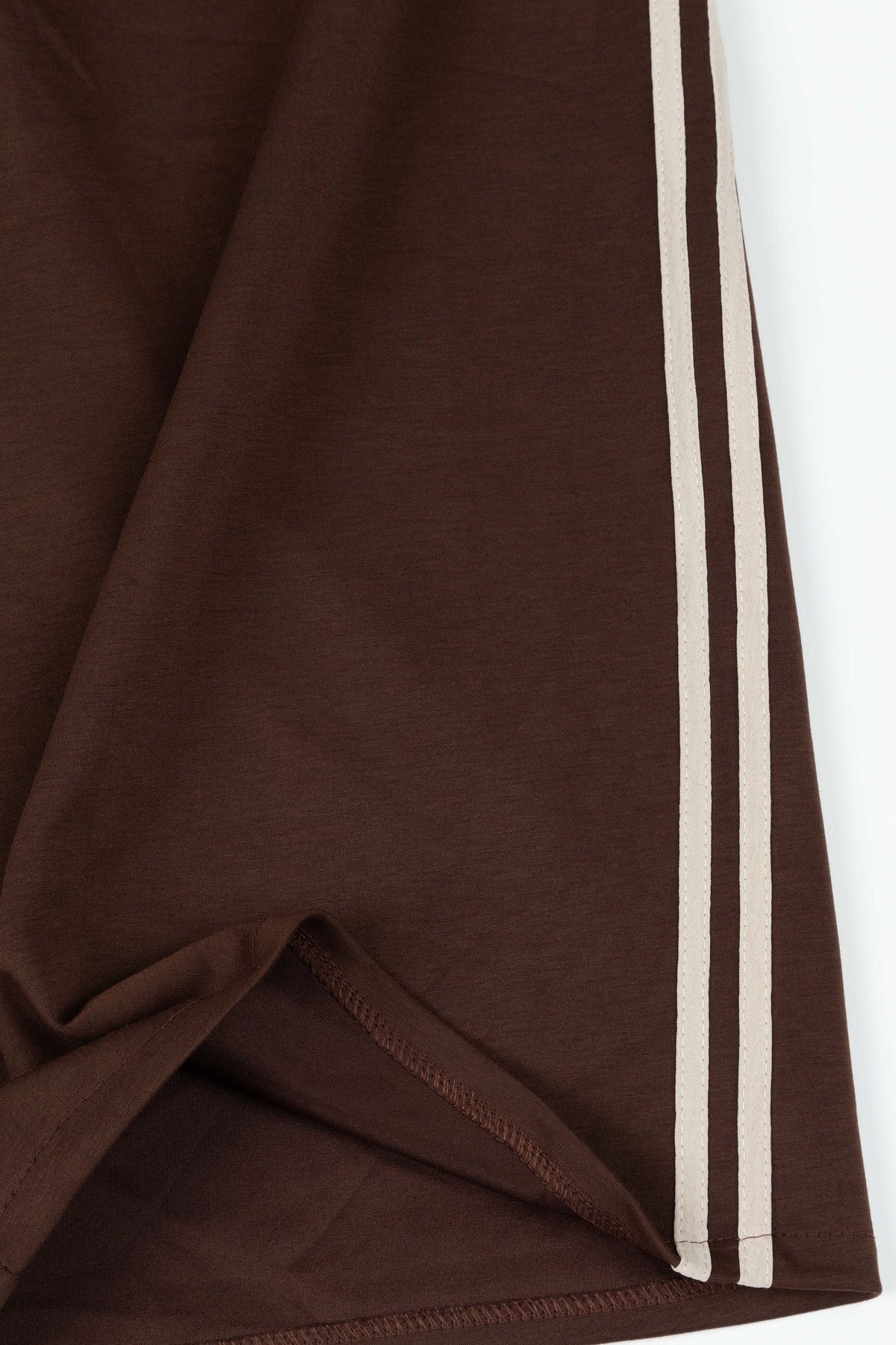 Brown fabric with white stripes on a white background